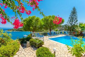 a villa with a pool and a view at Dolphin studio in Gaios