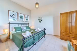 a bedroom with a bed and a wooden cabinet at Dolphin studio in Gaios +18 photos