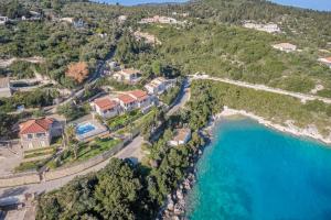 an aerial view of a house next to the ocean at Dolphin studio in Gaios