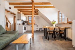 a living room with a table and a couch at Obsthof Mainberger in Kressbronn am Bodensee