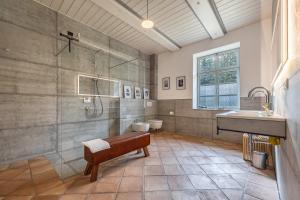 a bathroom with a sink and a shower and a sink at Suite Südterrasse mit Loftcharm in Dedelstorf +19 photos