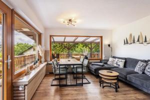 a living room with a couch and a table at Haus Sonnenblick in Diemelsee