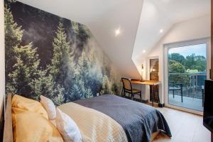 a bedroom with a large painting on the wall at Heimelige Schwarzwaldwohnung Wald in Häusern +16 photos