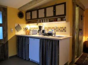 a kitchen with a sink and a counter top at Charlottes Landlust in Ribnitz-Damgarten