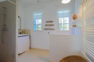 a bathroom with a shower and a sink at L'hermine - Villa de charme in Locquirec +28 photos
