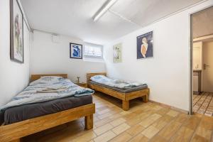 two twin beds in a room with a hallway at Tulip Path 3 in Melle