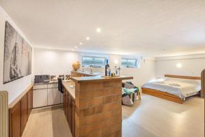 a kitchen with a sink and a bed in a room at Tulip Path 3 in Melle