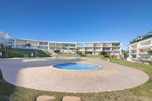 a large courtyard with a pool in front of a building at Casa Monte da Balaia in Olhos de Água