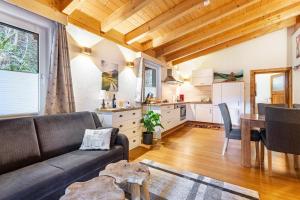 a living room with a couch and a table at Ferienwohnung Petra Top 3 in Kössen