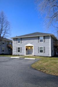 a large white house with a garage at Passive Stays Mountain Home 2BR in Mountain Home
