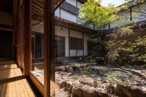 an external view of a japanese garden from a building at Mifuneyama Rakuen Hotel in Takeo