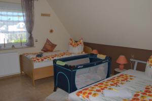 a room with two beds and a fish tank at Ferienwohnung Gabi in Borken