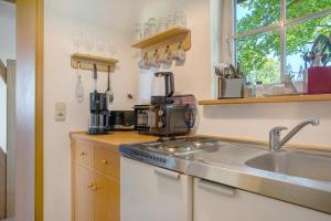 a kitchen with a sink and a counter top at Ferienhaus Kitzklause in Walkendorf
