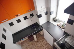 a small kitchen with a sink and a counter at Casa Caterina in Levanto +10 photos