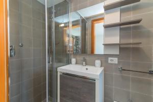 a bathroom with a sink and a shower at House Punta Nera in Palau