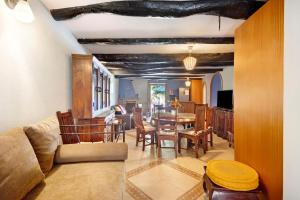 a living room with a couch and a table at Porto Douro - Maison in Foz do Sousa