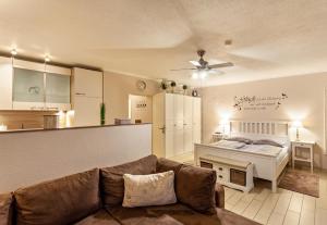 a living room with a couch and a bed at Ferienwohnung Bergidyll in Schmallenberg
