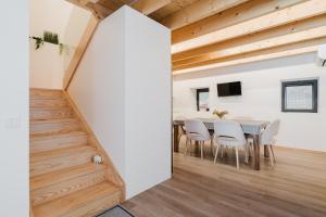 a dining room with a table and chairs at Dunas e Abraços in Braga