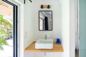 a bathroom with a sink and a mirror at Dune Lodge 1- Capbreton Hossegor - in Capbreton