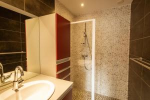 a bathroom with a sink and a shower at Chalet Lova in Valloire +10 photos
