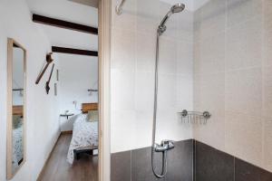 a bathroom with a shower with a glass door at Casa Tajaraste 1 in Hermigua +15 photos