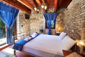 Postel nebo postele na pokoji v ubytování Pilikas Luxury Villas