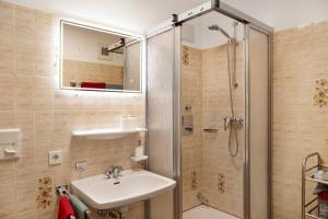 a bathroom with a sink and a shower at Aschaubichl - Wohnung Narzisse in Grainau +12 photos