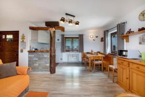 a living room with a kitchen and a dining room at Maison Sylvie Pila in Gressan