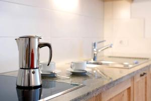 a coffee maker sitting on a counter in a kitchen at Kaltenhauser Hof in Masserie +85 photos