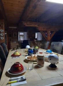 a table with plates of food on it at Le Mont De La Source in Lafarre
