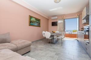 a living room with a couch and a table at Villa Veronica in Mascali +18 photos