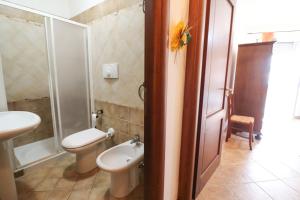 a bathroom with a toilet and a sink at Casa Samira a Otranto in Otranto +27 photos