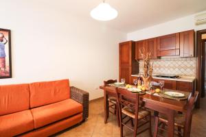 a living room with a couch and a table at Casa Samira a Otranto in Otranto