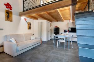 a living room with a couch and a table at Chez Margot Et Sophie in Torgnon