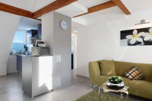 a living room with a couch and a table at Ferienwohnungen Steiert in Freiburg im Breisgau
