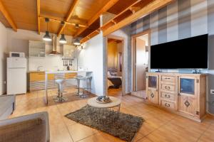 a large living room with a large flat screen tv at Chabela's Penthouse in Lajita