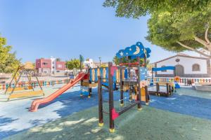 a playground with a slide at Chabela's Penthouse in Lajita