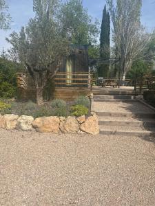 a set of stairs with rocks in a park at Domaine 3016 in Roquebrune-sur-Argens