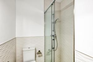 a shower with a glass door in a bathroom at Casa en Begur reformada in Begur +22 photos