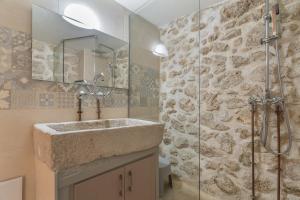 a bathroom with a sink and a shower at Maniaveta's House in Exanthia +19 photos