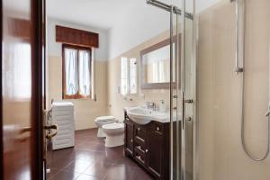 a bathroom with a toilet and a sink and a shower at Zio Gennaro Residence in Agerola +77 photos