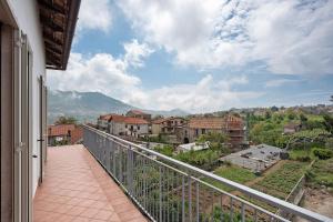 a balcony with a view of a city at Zio Gennaro Residence in Agerola