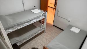 a refrigerator with its door open in a room at Cabaña Conectar Naturaleza in Ituzaingó