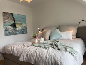 a bedroom with a large bed with flowers on it at Meerzeit in Eckernförde