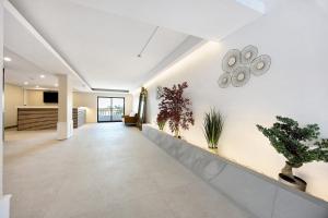 an office lobby with plants on the wall at Apartamento Mar-colina-sol in Carvoeiro