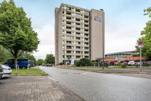 a large building on the side of a street at Ferienwohnung 'Segelyachten-Perle' in Schilksee