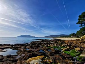 a view of the beach from the shoreline at O Son in Cee