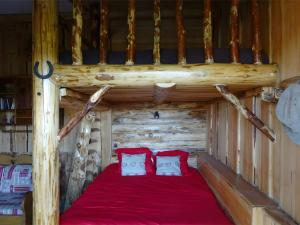 two pillows on a bed in a log cabin at Le Mont De La Source in Lafarre