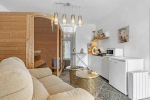 a living room with a couch and a kitchen at Bohemia in Jávea