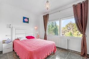a bedroom with a bed and a large window at Bohemia in Jávea +18 photos
